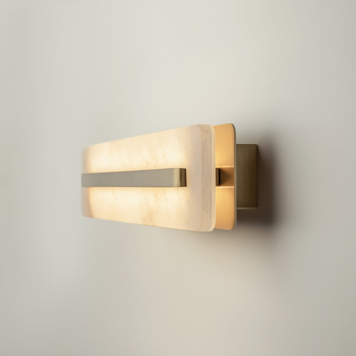 Modern wall-mounted light fixture on a neutral background