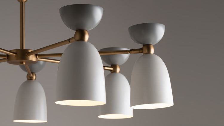 Modern round crystal drum chandelier Maytoni with a silver metal frame, illuminated against a dark background