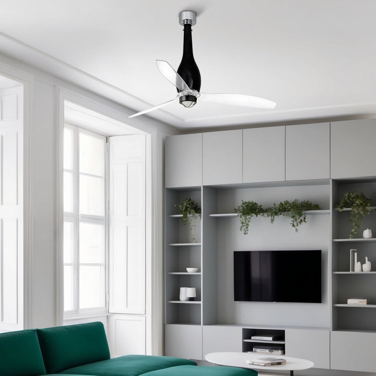 Modern living room with green sofa, white walls, and ceiling fan.
