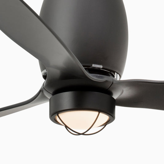 Close-up of a matte black three-blade ceiling fan with an integrated light fixture, shown against a solid white background.