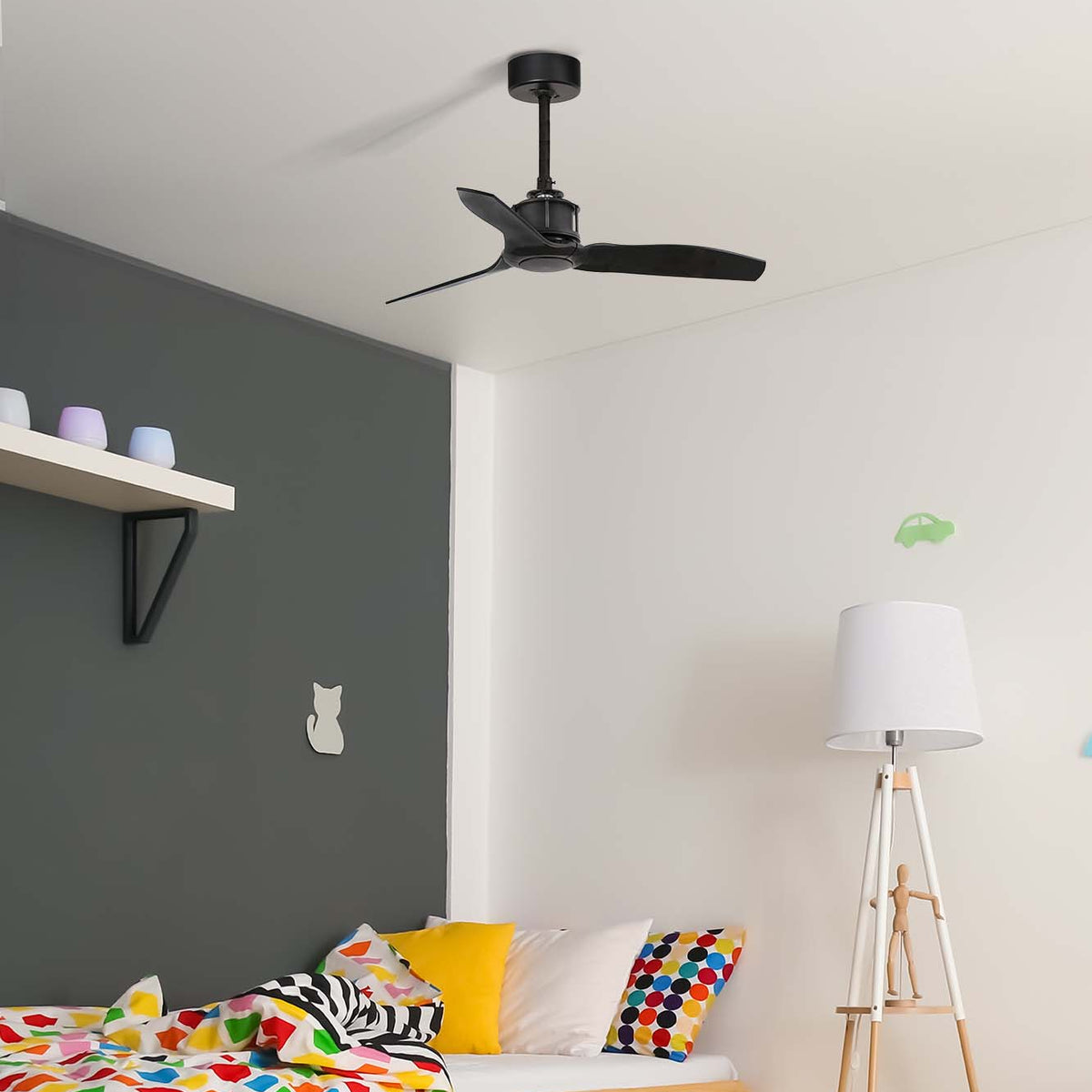 Children's bedroom with a wooden bed, colorful bedding, and a ceiling fan.