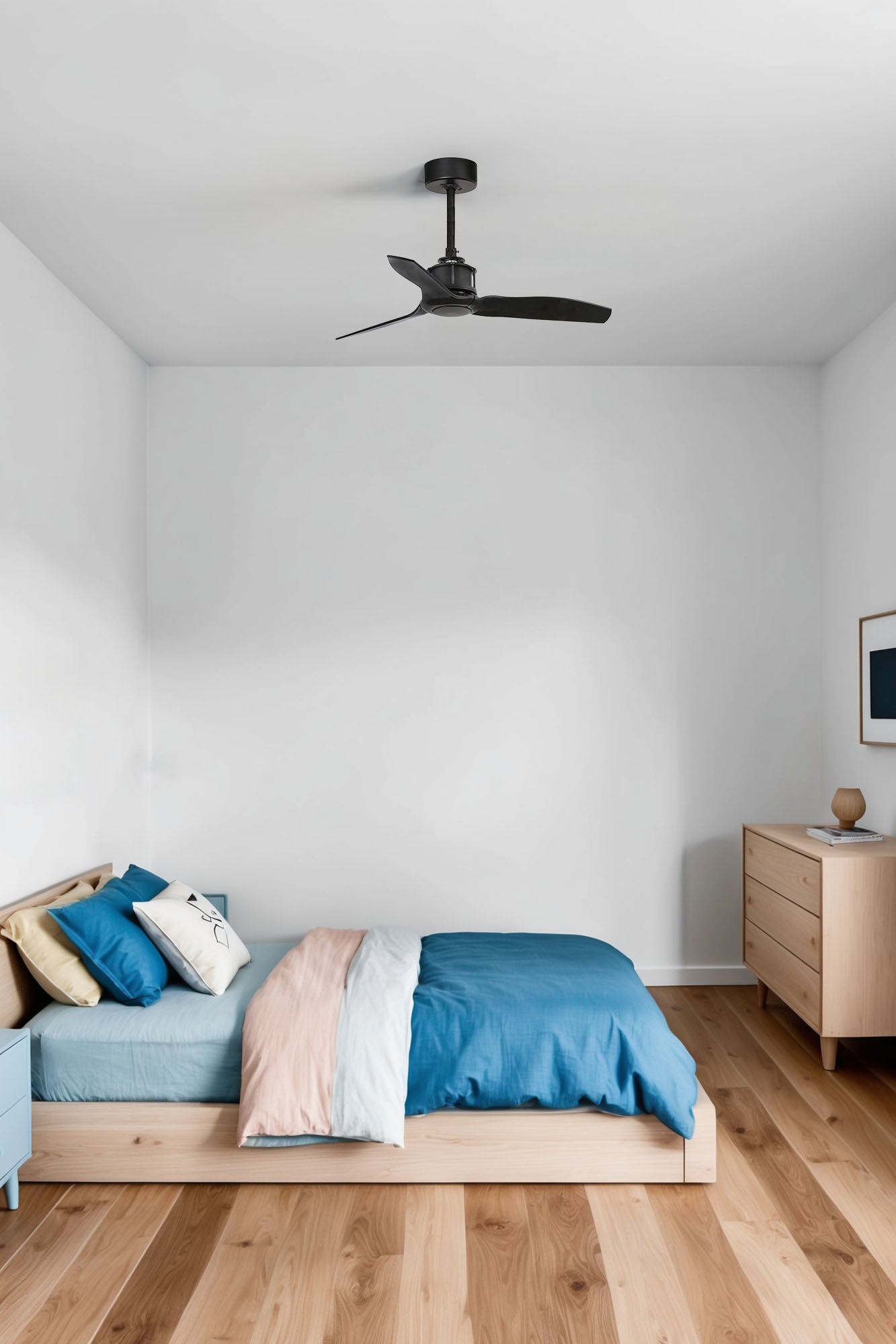 Modern bedroom with wooden bed, blue bedding, and ceiling fan.