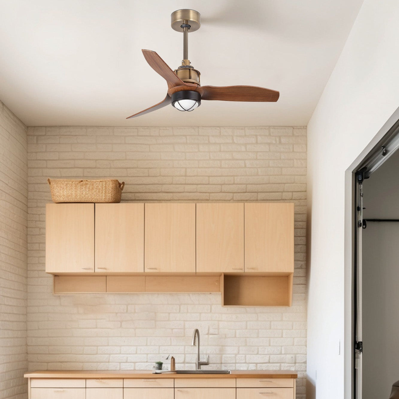 Modern kitchen with wooden cabinets and a ceiling fan.
