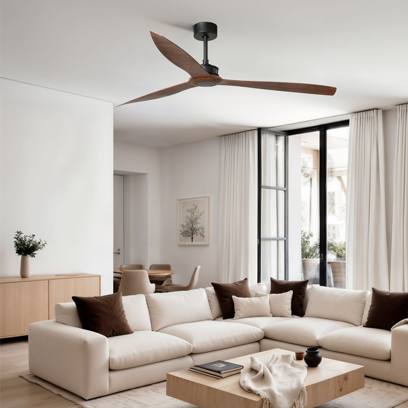 Modern living room with a sectional sofa, coffee table, and ceiling fan.