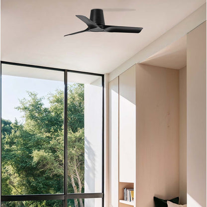 Modern interior with a ceiling fan, large window, and cozy seating area.