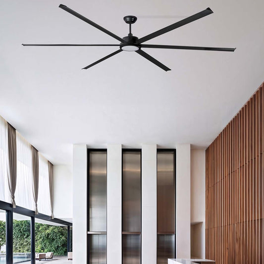Modern interior with a ceiling fan, large windows, and a wooden wall.