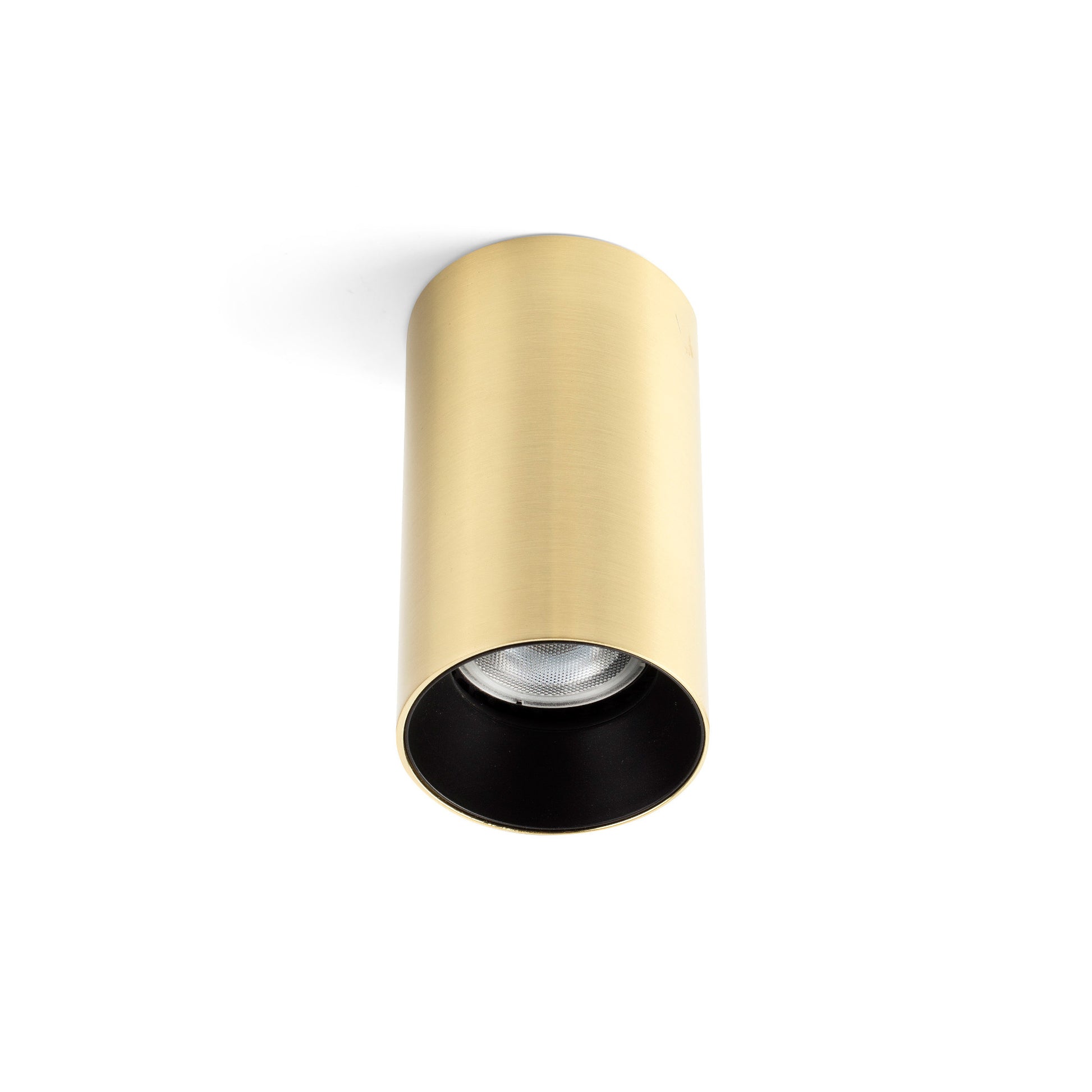 Gold cylindrical light fixture on a white background