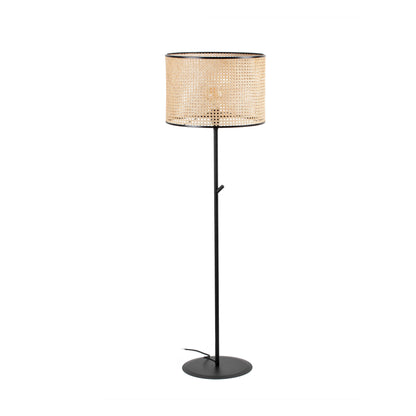 Floor lamp with a woven shade on a white background