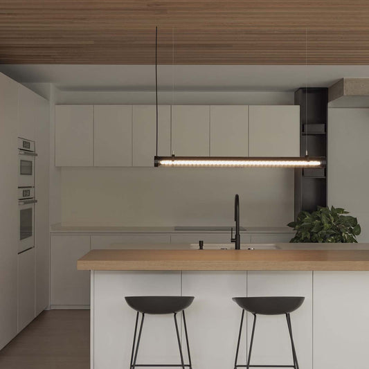 Modern kitchen with wooden island and pendant lights