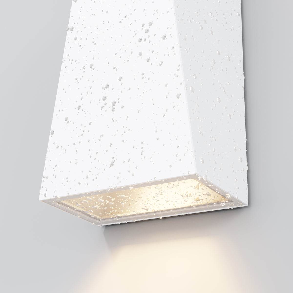 Modern wall-mounted light fixture with textured white surface on a gray background
