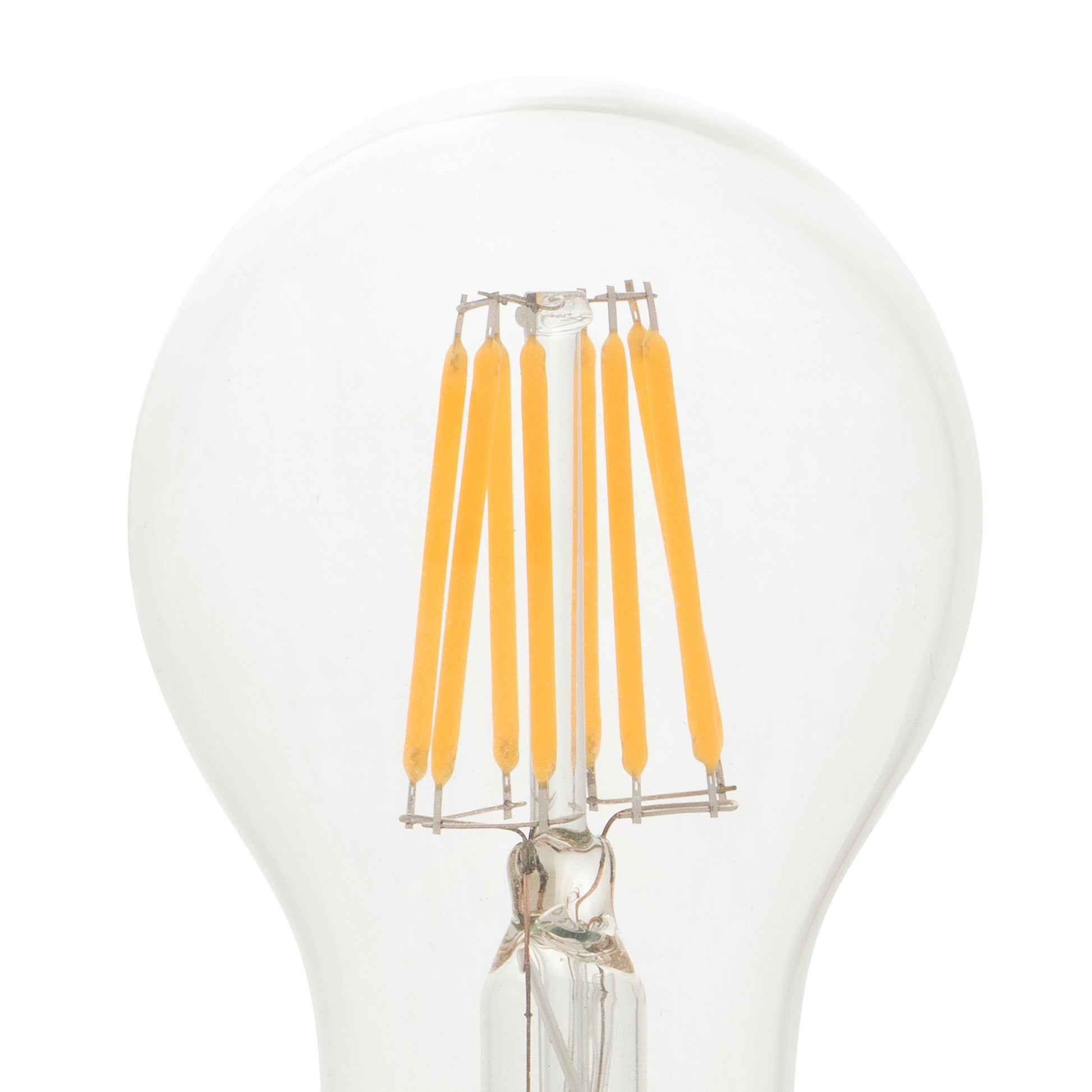 Clear light bulb with yellow filaments on a white background
