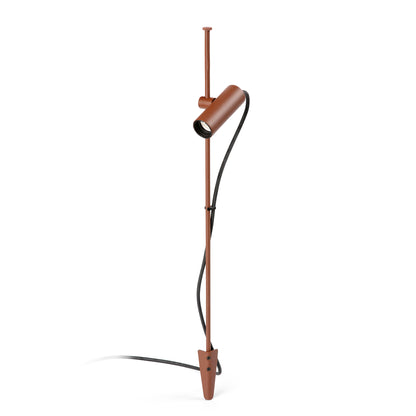 A modern minimalist floor lamp with a matte brown metal pole, a matching cylindrical shade, and a black power cord, shown against a solid white background.