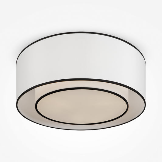 Ceiling light fixture with white shade and black trim on a white background