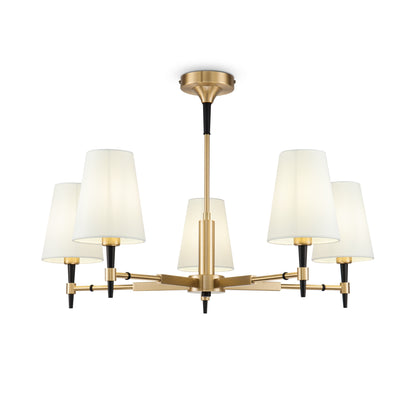 Modern chandelier with white lampshades and gold metal fixture on a white background
