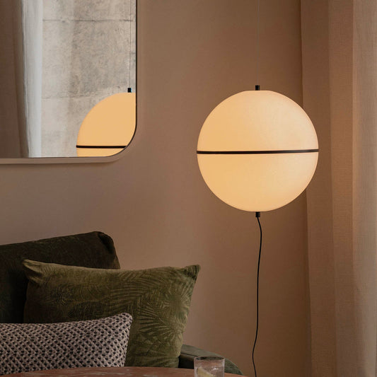 Modern interior with a round table, chairs, and a floor lamp.