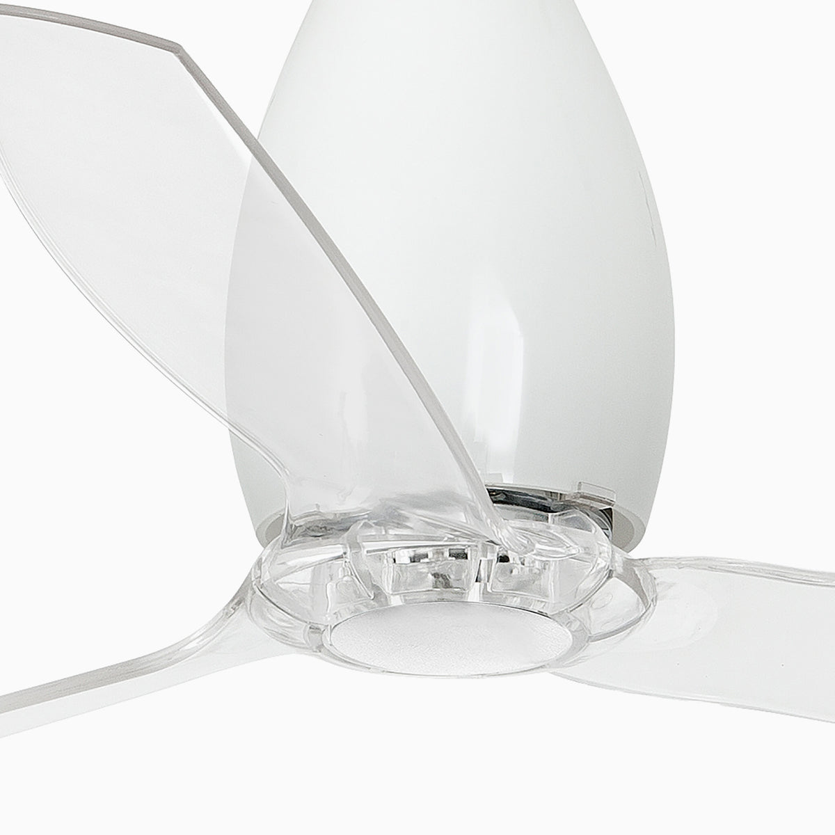 Close-up detail of the Eterfan Ø128cm DC motor ceiling fan showcasing the gloss white central housing and the transparent polycarbonate blade assembly against a white background. Available to buy at the VXR Space store.