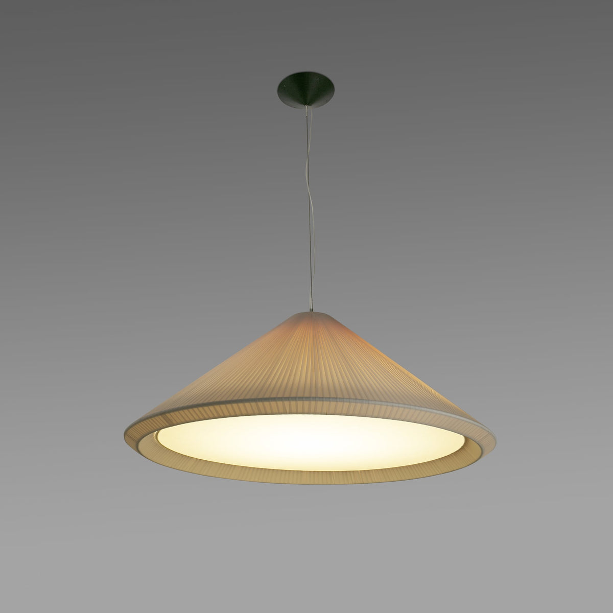 The Saigon-In 1300 ivory white pendant light by Faro Barcelona, glowing with a warm ambient light diffused through its pleated ribbon shade. Available to buy at the VXR Space store.