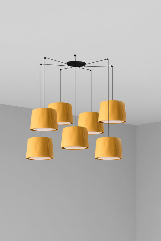 The Samba 7L black pendant light by Faro Barcelona featuring seven cascading yellow ribboned lampshades with papyrus diffusers. Available to buy at the VXR Space store.
