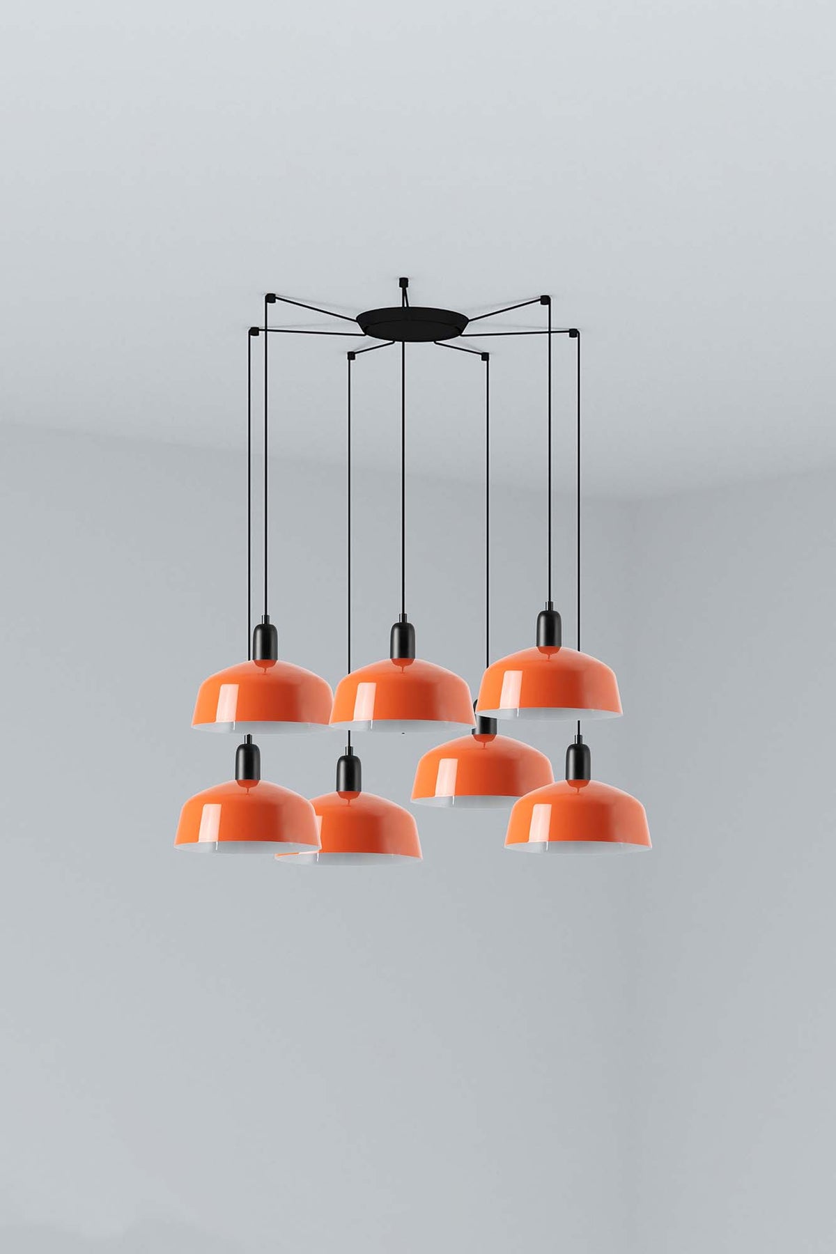 The Faro Barcelona Tatawin 7-light pendant lamp featuring a cluster of gloss reddish-orange steel shades suspended from a minimalist black structure. Featured in the VXR Space lighting collection.