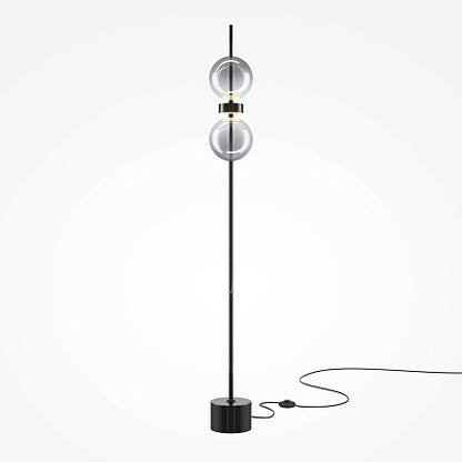 Modern floor lamp with spherical design on a white background
