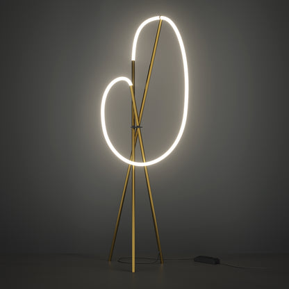 Modern floor lamp with circular light design on a dark background