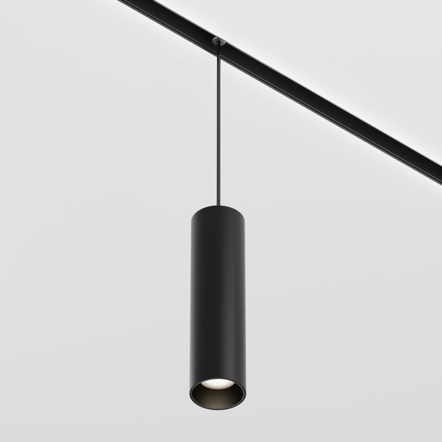 Black cylindrical pendant light on a white background