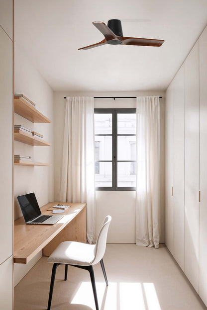 Modern home office with wooden desk, laptop, and white chair.
