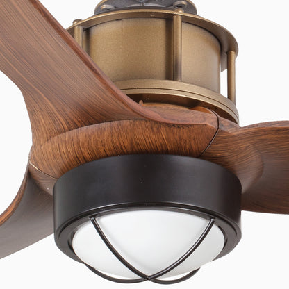 Close-up of a ceiling fan with wooden blades and a light fixture.