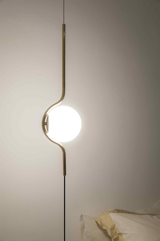 Modern pendant light fixture on a neutral wall