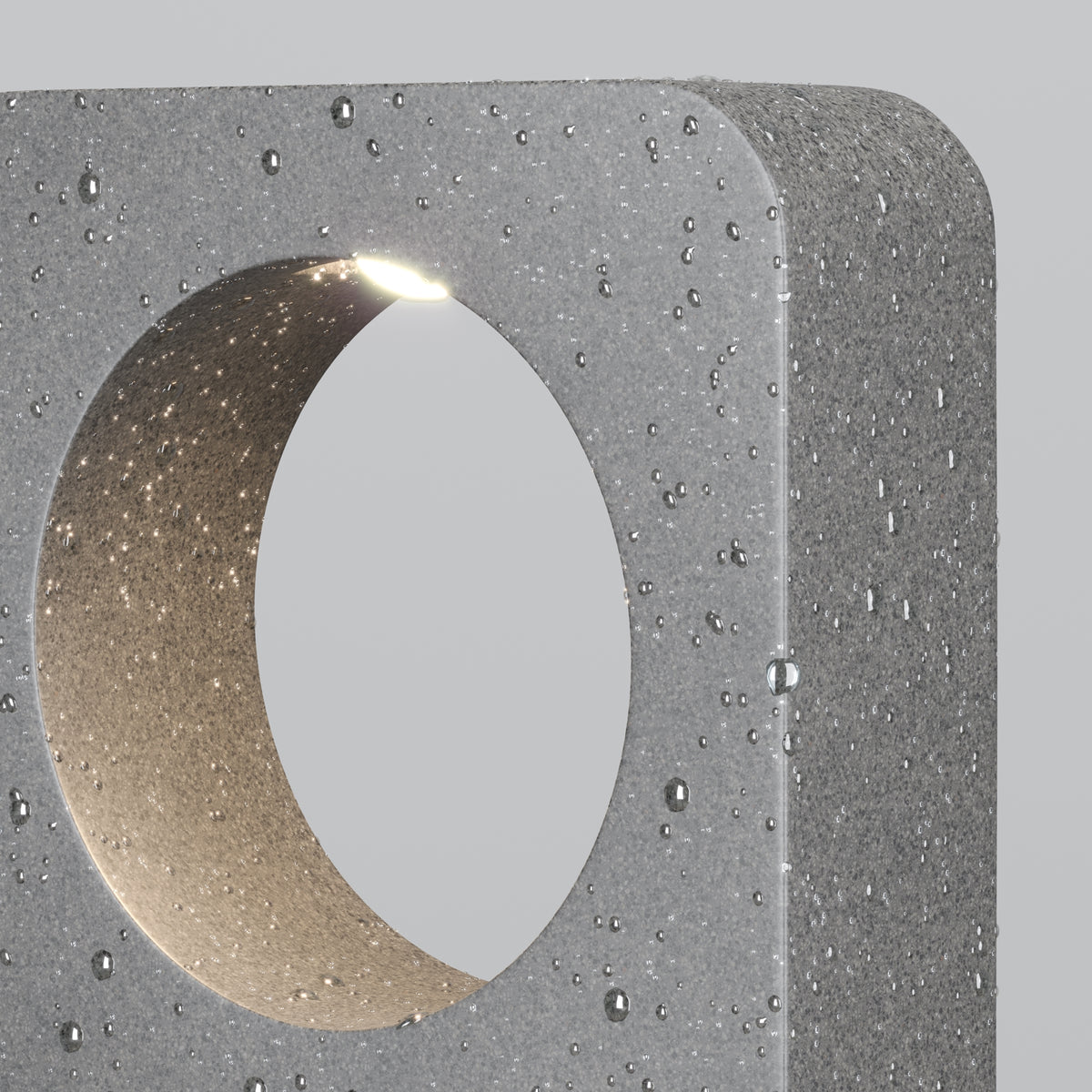Concrete block with a circular cutout on a gray background