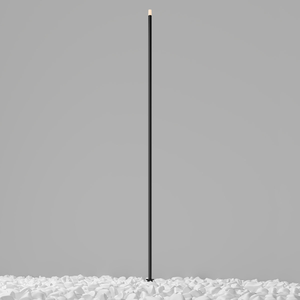 Black cylindrical object on a gray background