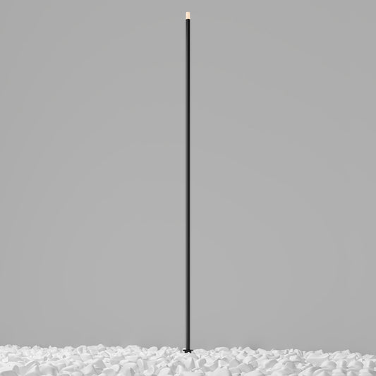 Black cylindrical object on a gray background