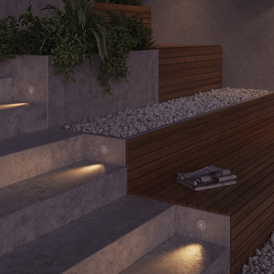 Modern outdoor concrete steps with Lighting for stairs Lock, a wooden slat bench with a folded magazine, white gravel, and a planter box with green trailing plants.