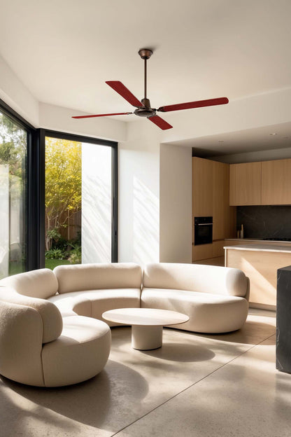 Modern living room with a curved beige sofa, coffee table, and ceiling fan.