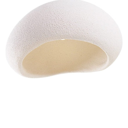 Close-up underside view of the MAXLight Pierre 48cm organic white resin pendant light revealing its hollow, textured interior and asymmetrical opening against a white background. Available to buy at the VXR Space store.