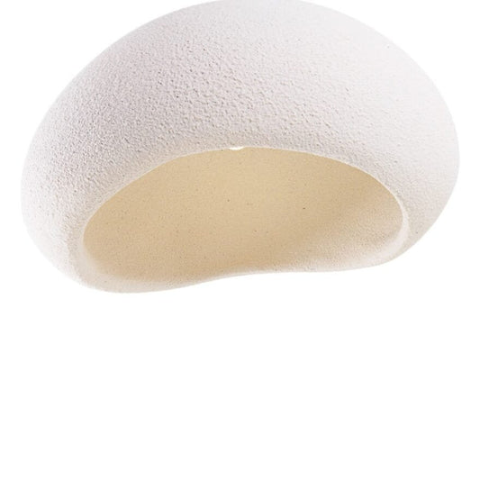 Close-up underside view of the MAXLight Pierre 48cm organic white resin pendant light revealing its hollow, textured interior and asymmetrical opening against a white background. Available to buy at the VXR Space store.