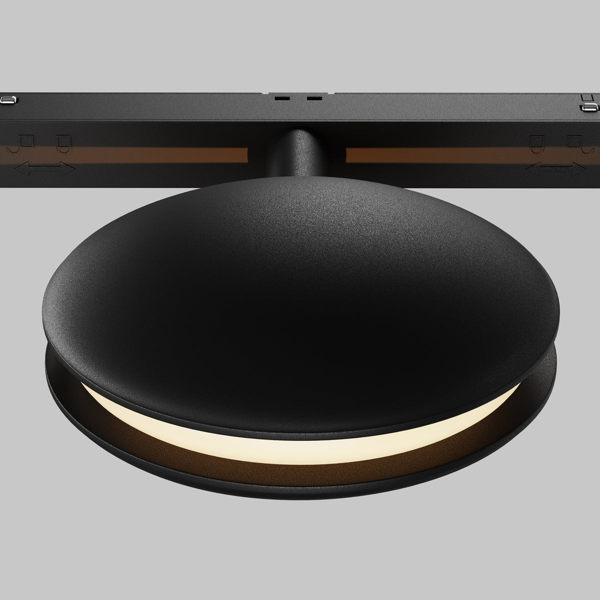 Modern black ceiling light fixture on a gray background