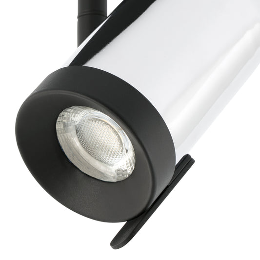 Close-up of a black and white spotlight on a white background