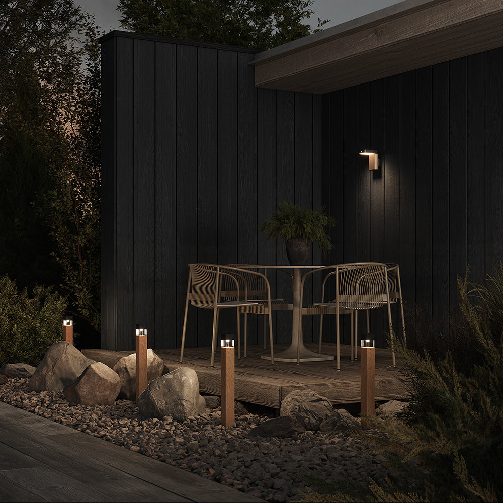 Outdoor patio area with furniture and lighting at night