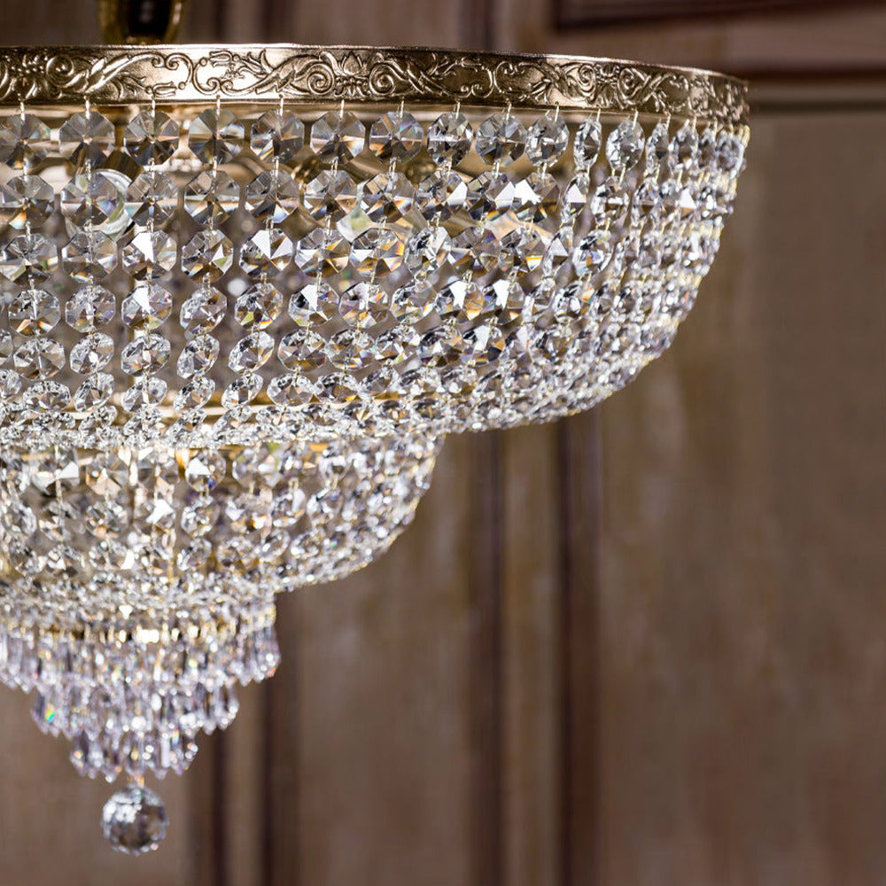 Studio view of the grand 18-light Palace gold crystal flush-mount chandelier showcasing multi-tiered crystal drops. Featured in the VXR Space luxury lighting collection.