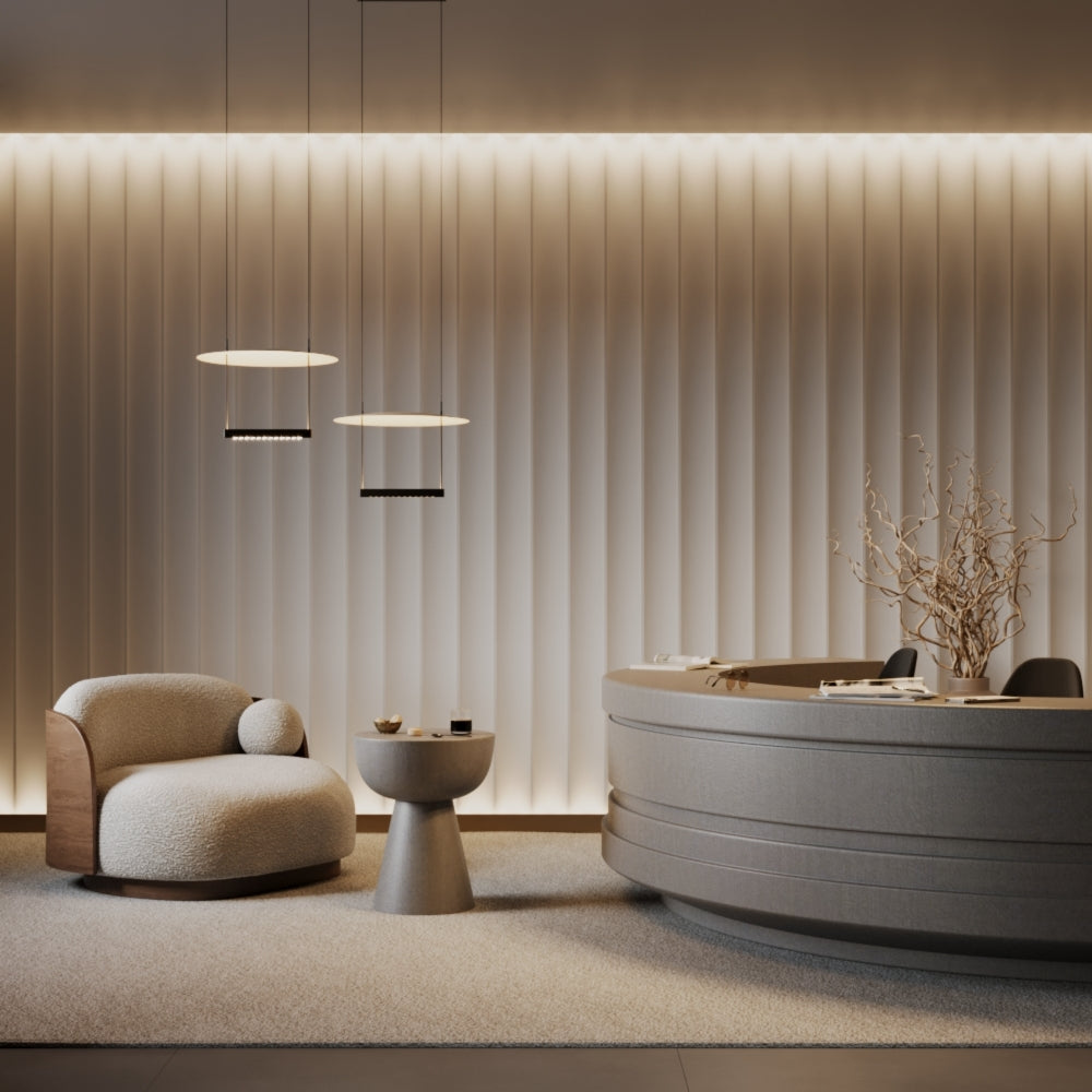 Modern interior with a round ottoman, floor lamp, and bathtub.