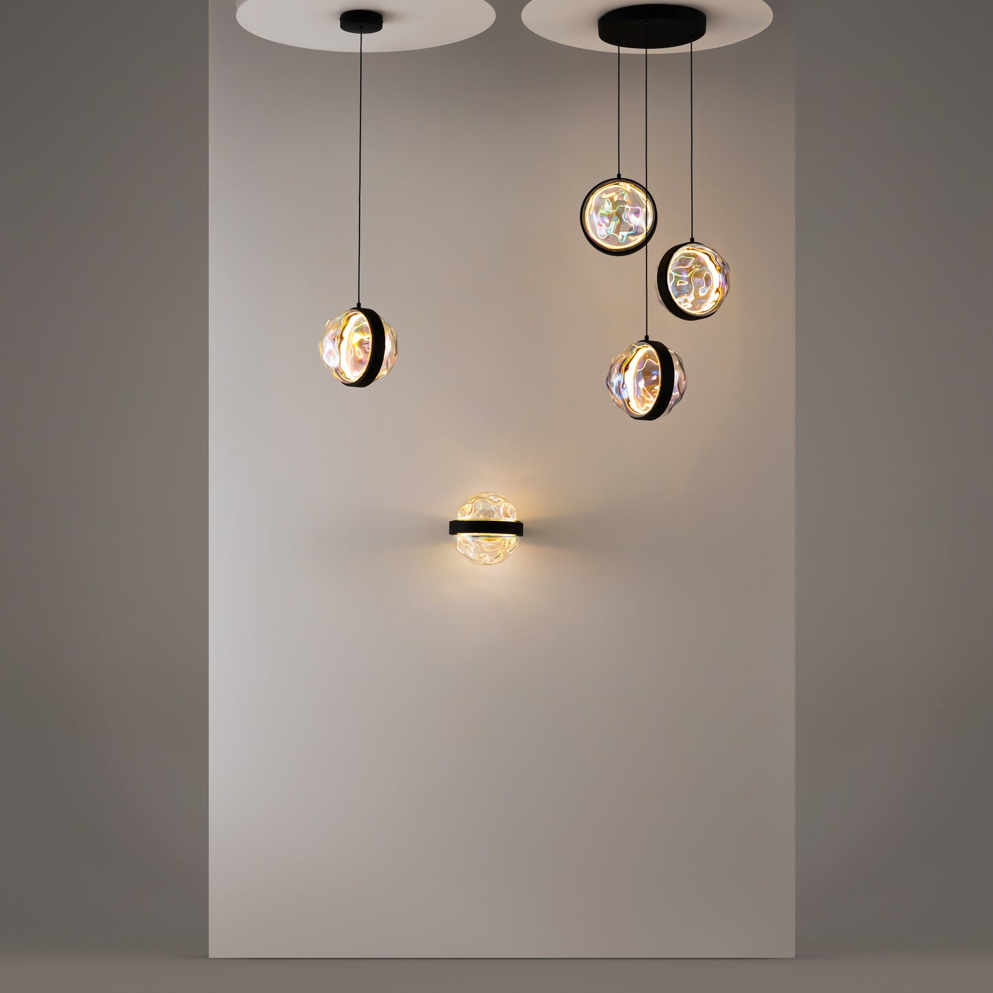 Modern pendant lights hanging against a gray wall