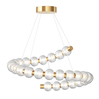 Modern chandelier with gold accents and clear glass spheres on a white background