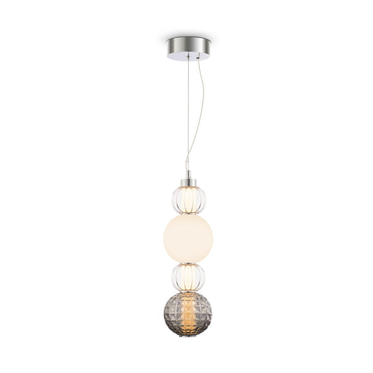 Modern pendant light with three glass shades on a white background