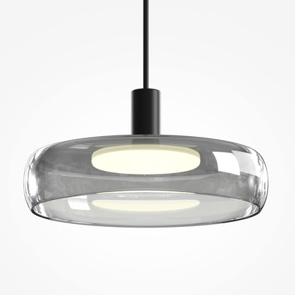 Modern pendant light with glass shade and black fixture on a white background