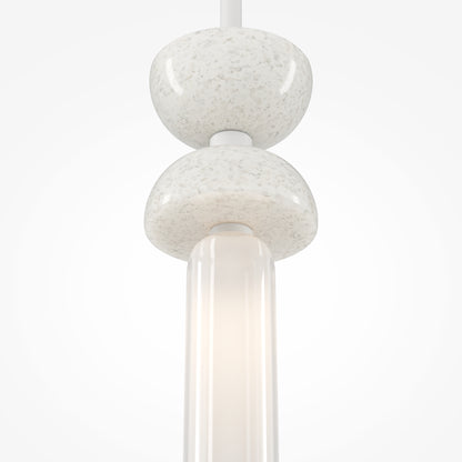 Modern pendant light with marble-like finish on a white background