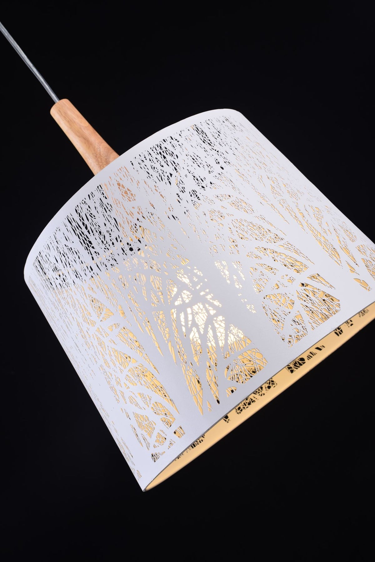 Decorative lamp with white and gold pattern on a black background