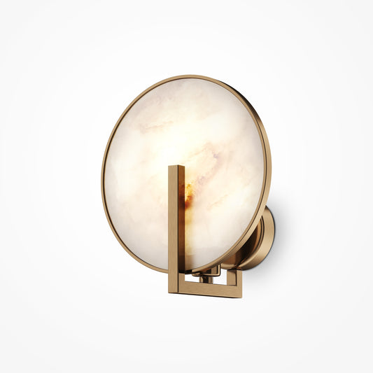 Wall-mounted light fixture with gold frame and white glass on a white background