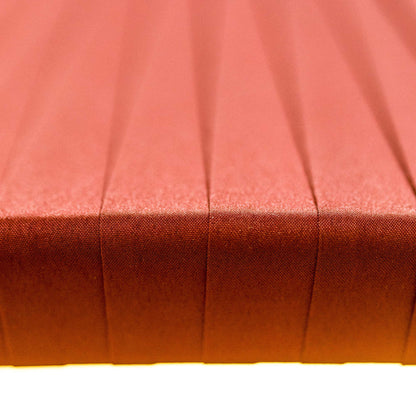 Close-up of a red fabric surface with pleated texture
