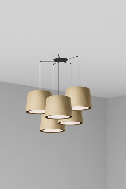 Modern pendant light with three beige lampshades on a neutral background
